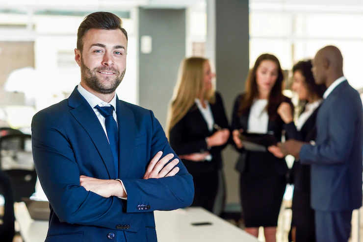 4 Reasons To Consider Taking An Executive Leadership Course businessman leader modern office with businesspeople working 1139 961 - 4 Reasons To Consider Taking An Executive Leadership Course